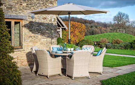 Bramblecrest Monterey Sandstone 6 Seater Round Dining Set - Includes Lazy Susan Parasol & Base Bramblecrest Monterey Sandstone 6 Seater Round Dining Set - Includes Lazy Susan Parasol & Base